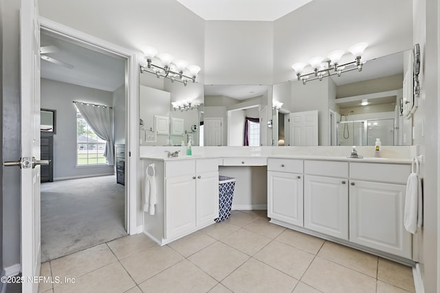 245 Village Green Ave, Fruit Cove, FL 32259 - bathroom with tile patterned floors, baseboards, vanity, and a shower stall