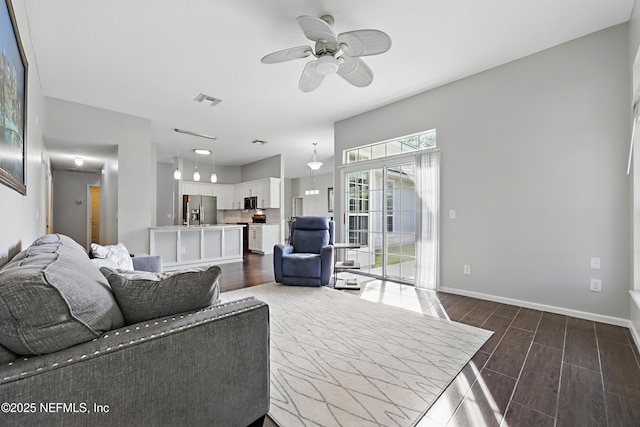 245 Village Green Ave, Fruit Cove, FL 32259 - living area with wood tiled floor, visible vents, a ceiling fan, and baseboards