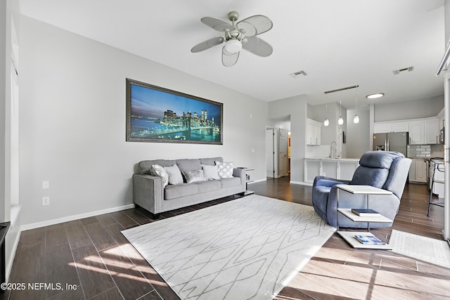 245 Village Green Ave, Fruit Cove, FL 32259 - living area with visible vents, a ceiling fan, baseboards, and dark wood-style flooring