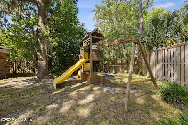 view of jungle gym with fence