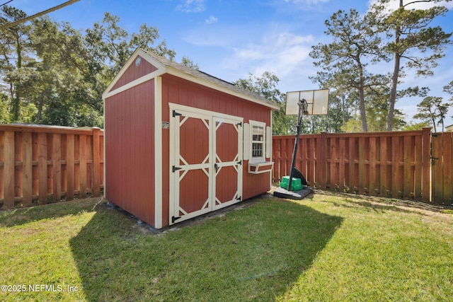 view of shed with a fenced backyard