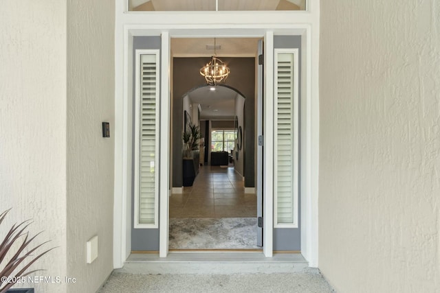doorway to property with stucco siding