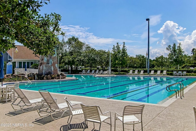 community pool with a patio area