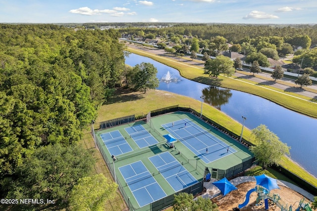 aerial view with a water view and a view of trees