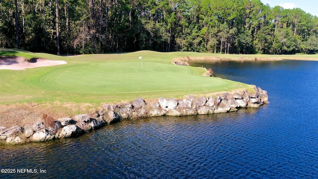 view of home's community featuring a water view and golf course view