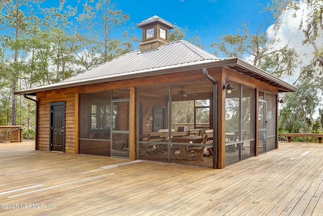 deck featuring a sunroom