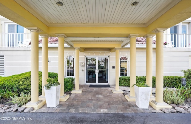 view of exterior entry featuring french doors