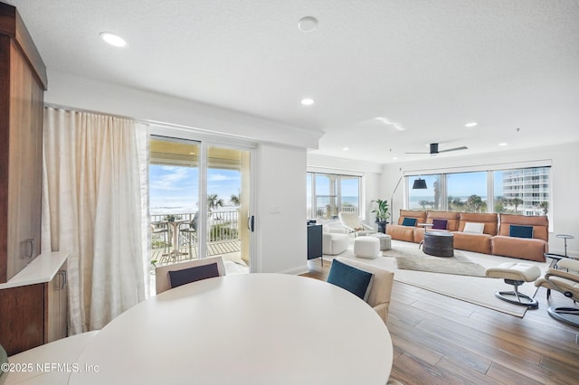 dining room with wood finished floors and recessed lighting