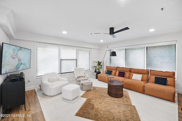 living area featuring wood finished floors, baseboards, ceiling fan, and recessed lighting