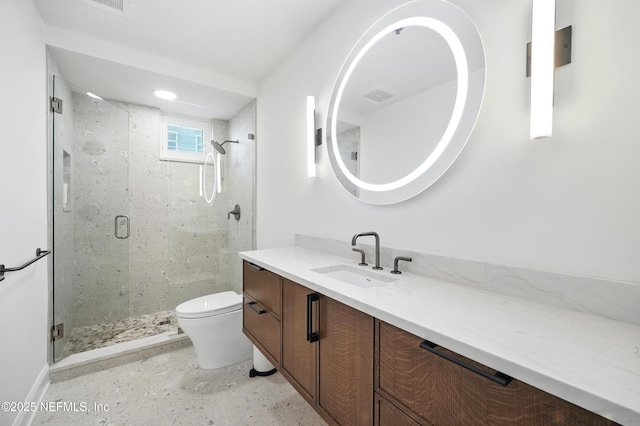full bath with toilet, a stall shower, vanity, and baseboards