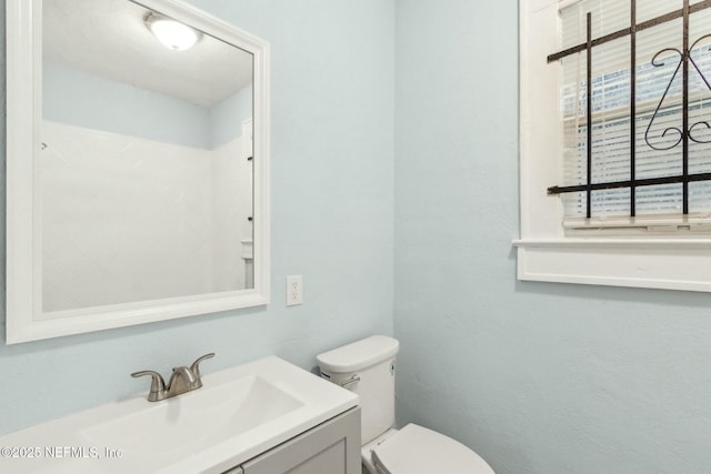 half bath with toilet and vanity