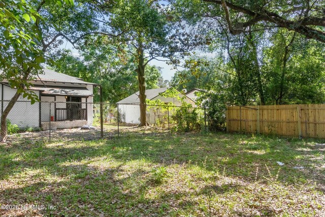 view of yard with a fenced backyard