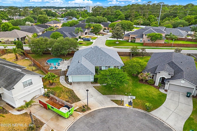 birds eye view of property with a residential view