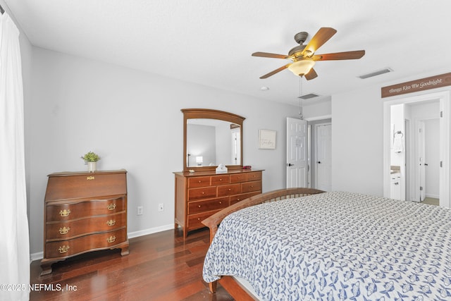 bedroom featuring baseboards, a ceiling fan, wood finished floors, and visible vents