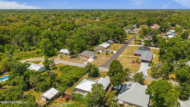aerial view featuring a residential view and a forest view
