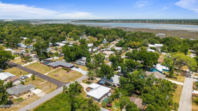 drone / aerial view featuring a water view and a residential view