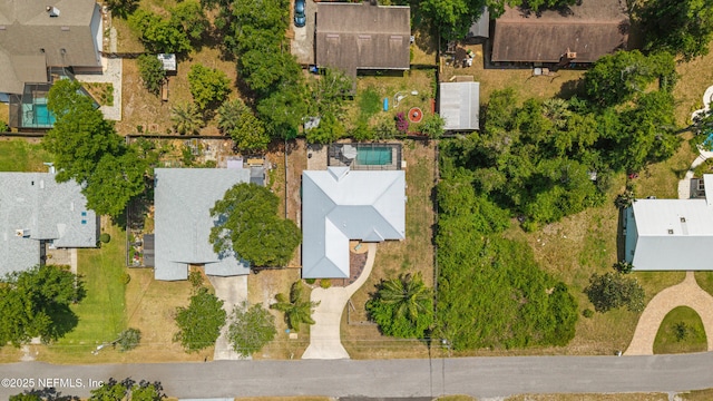 birds eye view of property with a residential view