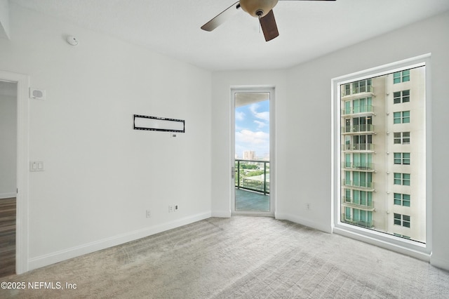 1431 Riverplace Blvd Unit 2003, Jacksonville, FL 32207 - carpeted empty room with a ceiling fan and baseboards