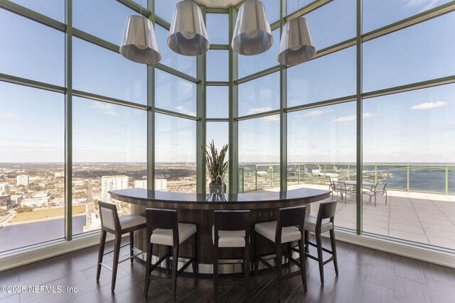 1431 Riverplace Blvd Unit 2003, Jacksonville, FL 32207 - dining area featuring a wealth of natural light, expansive windows, and a towering ceiling