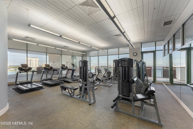 1431 Riverplace Blvd Unit 2003, Jacksonville, FL 32207 - exercise room with floor to ceiling windows, visible vents, carpet, and plenty of natural light