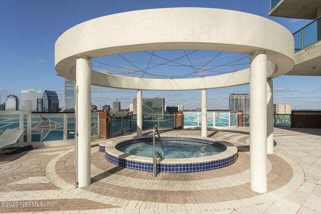 1431 Riverplace Blvd Unit 2003, Jacksonville, FL 32207 - view of patio / terrace with a city view and a hot tub