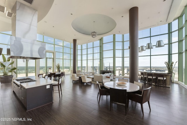 1431 Riverplace Blvd Unit 2003, Jacksonville, FL 32207 - dining room featuring dark wood-style floors, visible vents, a high ceiling, and expansive windows
