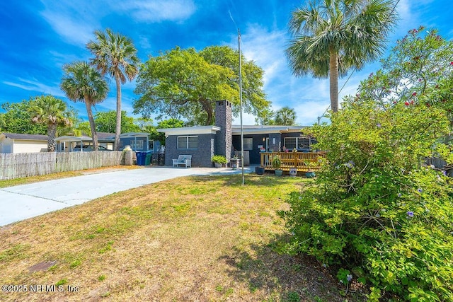 573 Oleander St, Neptune Beach, FL 32266 - ranch-style house featuring a chimney and a wooden deck
