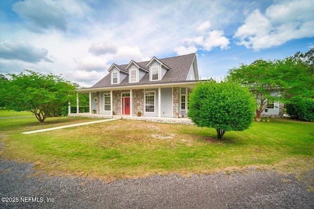 view of front of home featuring a porch, a front lawn, and stone siding