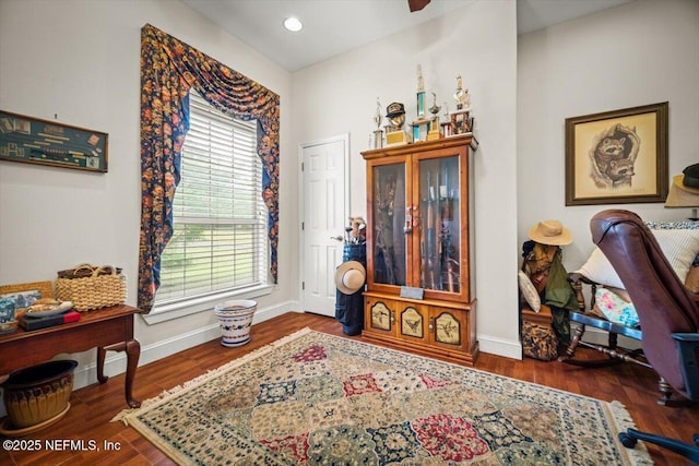 interior space with wood finished floors and baseboards