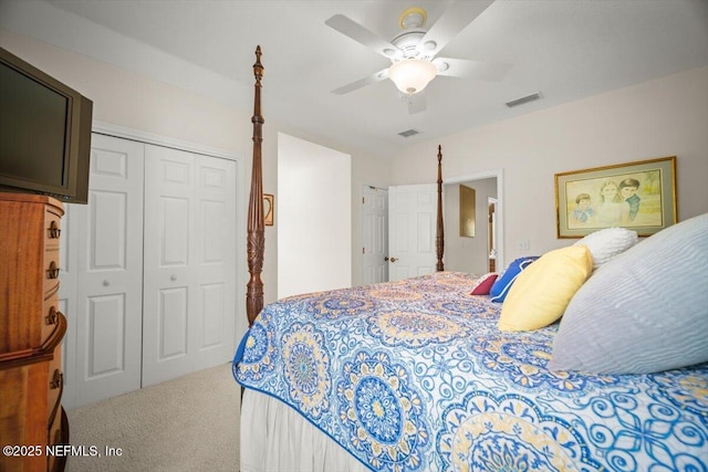 carpeted bedroom with visible vents, a ceiling fan, and a closet