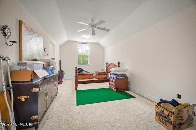 interior space featuring lofted ceiling, a ceiling fan, baseboards, and carpet floors
