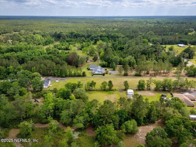 aerial view featuring a view of trees
