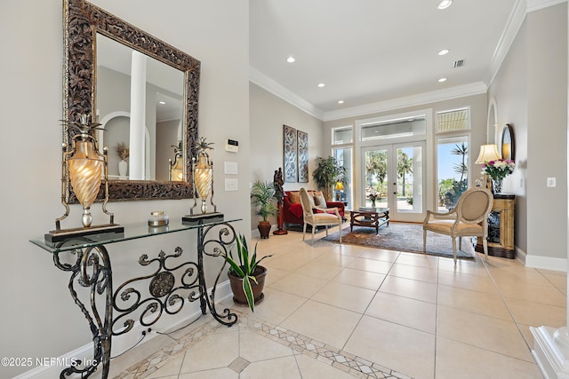 tiled foyer featuring recessed lighting, baseboards, visible vents, french doors, and crown molding