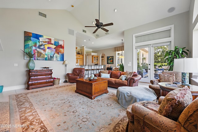 living area with baseboards, visible vents, ceiling fan, and french doors