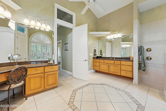 full bathroom featuring vanity, high vaulted ceiling, tile patterned floors, a ceiling fan, and walk in shower