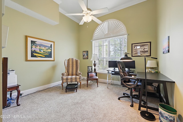 carpeted home office featuring a ceiling fan, ornamental molding, and baseboards