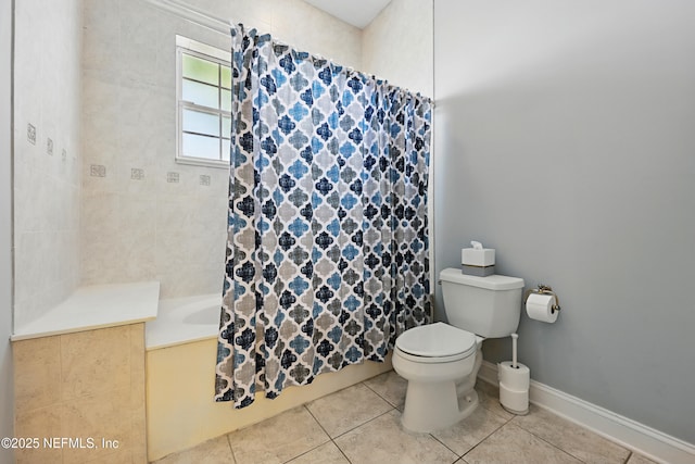 bathroom with tile patterned floors, shower / bath combo, toilet, and baseboards