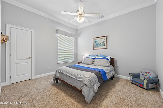bedroom featuring baseboards, crown molding, and carpet