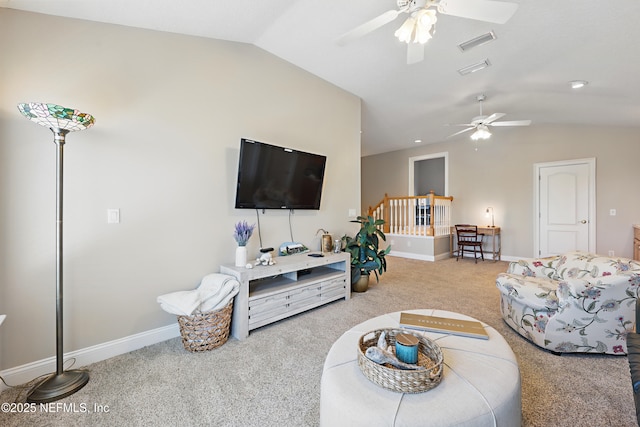 carpeted living room with ceiling fan, baseboards, lofted ceiling, and visible vents