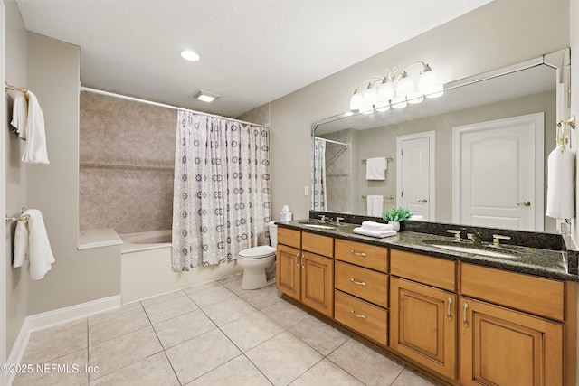 full bath featuring tile patterned floors, toilet, double vanity, and a sink