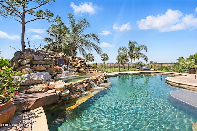view of pool with fence and a fenced in pool