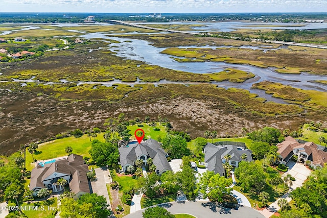 birds eye view of property with a water view and a residential view