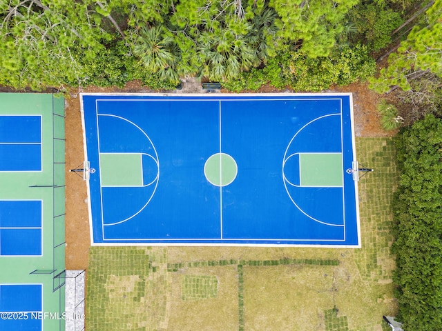 view of sport court with basketball hoop