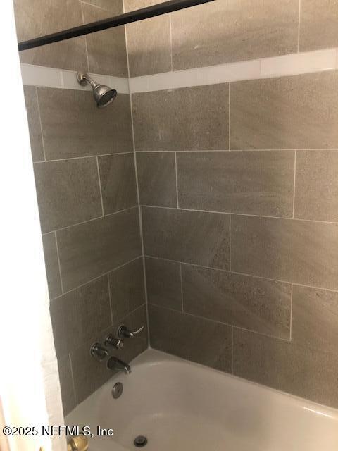 full bath featuring shower / bath combination