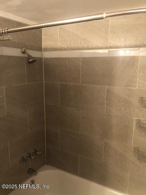 full bath featuring shower / washtub combination