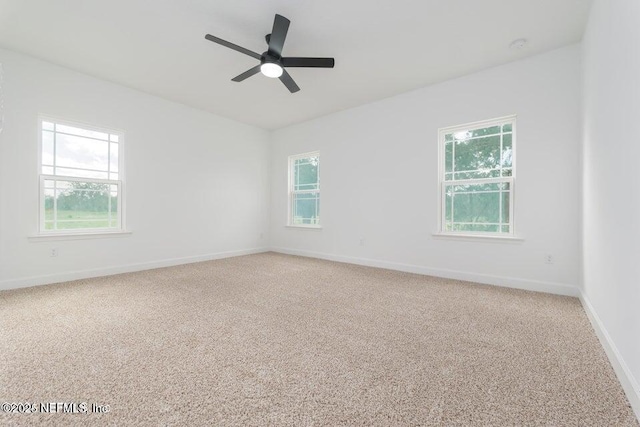 5817 Silver Sands Cir, Keystone Heights, FL 32656 - empty room with a ceiling fan, baseboards, and light carpet