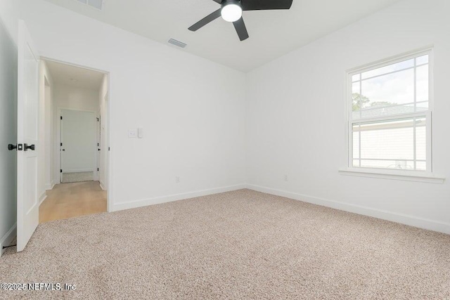 5817 Silver Sands Cir, Keystone Heights, FL 32656 - empty room with light carpet, a ceiling fan, visible vents, and baseboards