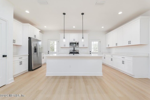 5817 Silver Sands Cir, Keystone Heights, FL 32656 - kitchen with plenty of natural light, visible vents, and appliances with stainless steel finishes