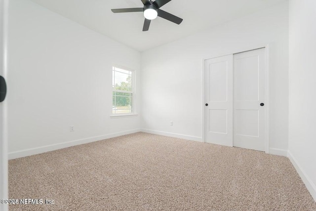 5817 Silver Sands Cir, Keystone Heights, FL 32656 - unfurnished bedroom with baseboards, a ceiling fan, carpet flooring, and a closet