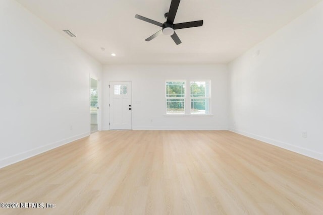 5817 Silver Sands Cir, Keystone Heights, FL 32656 - unfurnished living room with baseboards, a ceiling fan, visible vents, and light wood-style flooring